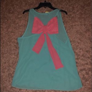 Mi a Mi blouse with pink ribbon on back in medium.